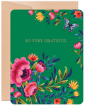 Vibrant green greeting card featuring an abundant floral design with pink peonies, orange and yellow flowers, and a colorful butterfly, with 'SO VERY GRATEFUL' in elegant gold text, accompanied by a kraft brown envelope.