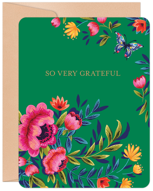 Vibrant green greeting card featuring a colorful floral border with pink, orange, and yellow blooms, a blue butterfly, and the message 'SO VERY GRATEFUL' in gold text, resting on a brown envelope.