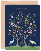 Elegant Thank You greeting card featuring two cranes under blossoming trees, with gold text and a dark blue background on a kraft envelope.
