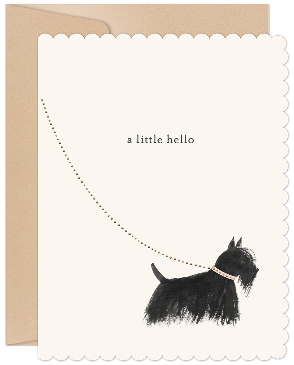 A cream-colored greeting card with scalloped edges, featuring a whimsical illustration of a black Scottish Terrier dog looking up at a dotted line forming an arc, with the text "a little hello" above. The dog wears a pink collar. A kraft envelope peeks out from behind the card.