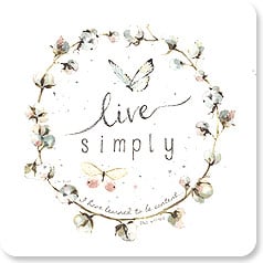 a wreath of flowers surrounds the words 'live simply I have learned to be content'